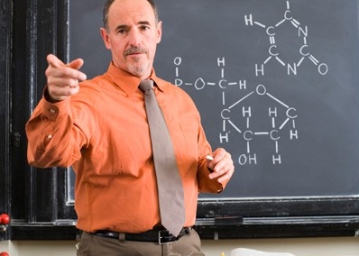 Professor in front of chalkboard Professor in front of chalkboard