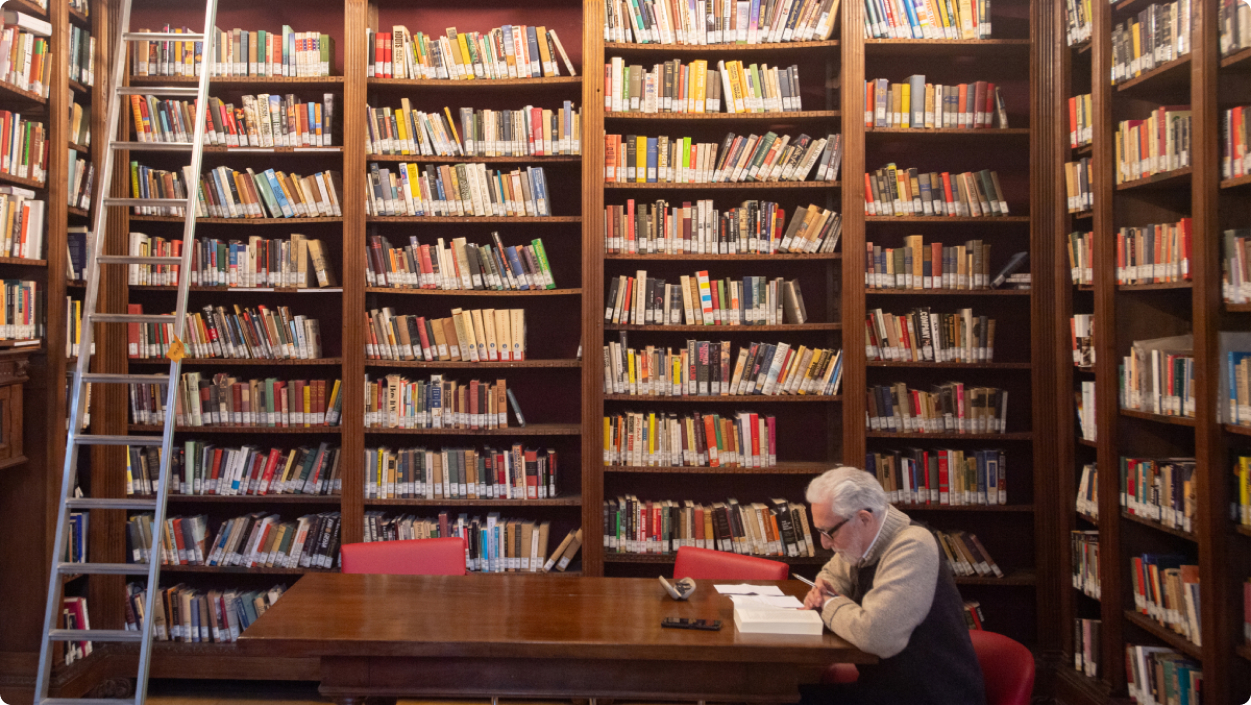 Student reading book in library