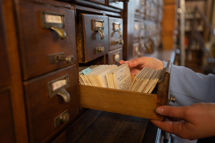 Open library filing cabinet with organised documents