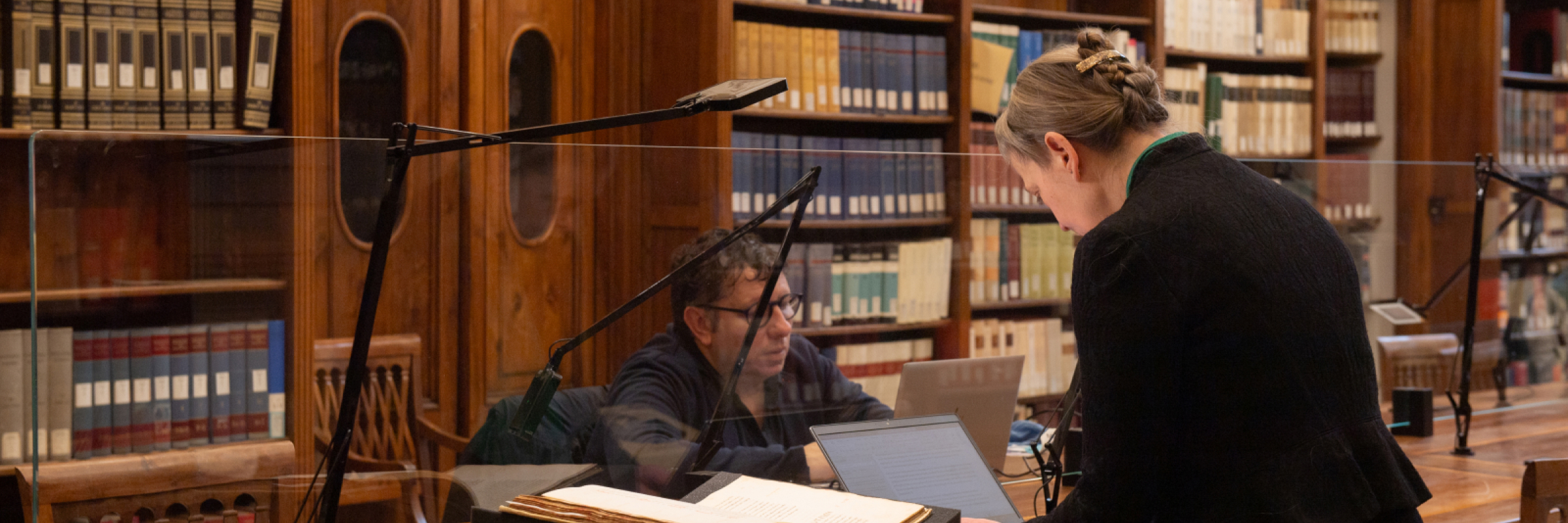 Researchers doing work inside a library